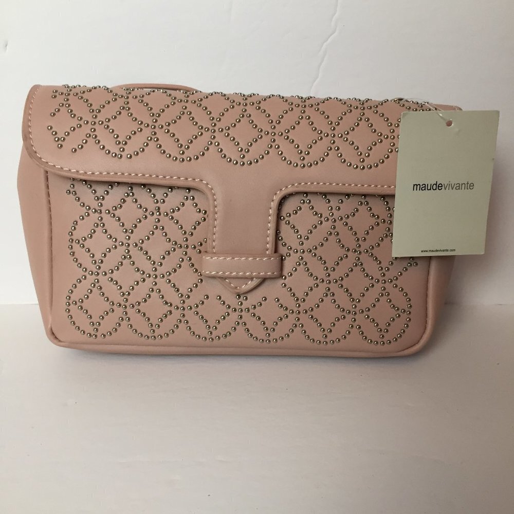 New blush pink purse rivet designs each side.